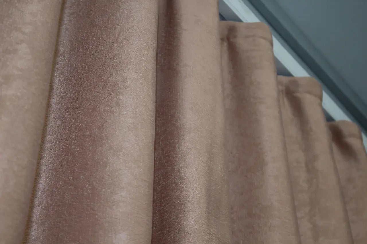 Muted mink velvet curtains with premium plush fabric, perfect for a warm and inviting home ambiance.
