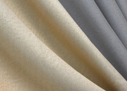 High-quality light grey and beige linen blackout curtains from the "Natural Blend" collection, providing both style and functionality.
