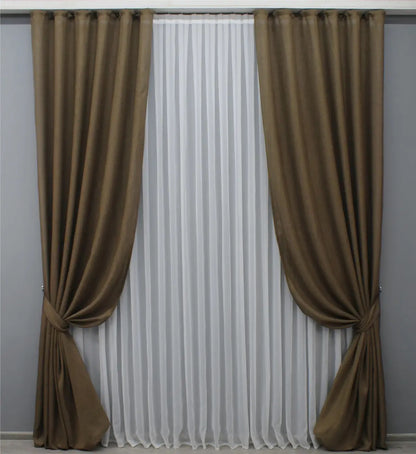 Natural brown burlap-style linen drapes with a soft matte finish, providing privacy while diffusing natural light.
