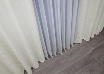 Classic cream linen curtains with a refined texture, creating a serene and sophisticated interior.
