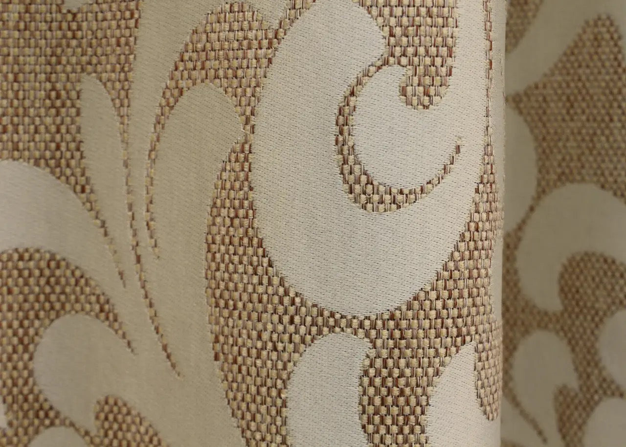 Decorative beige linen curtains with a woven ornamental motif, ideal for soft natural lighting.
