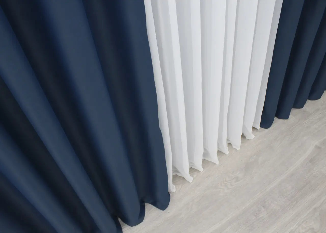 Navy blue blackout curtains with a rich, sophisticated look for modern interiors.
