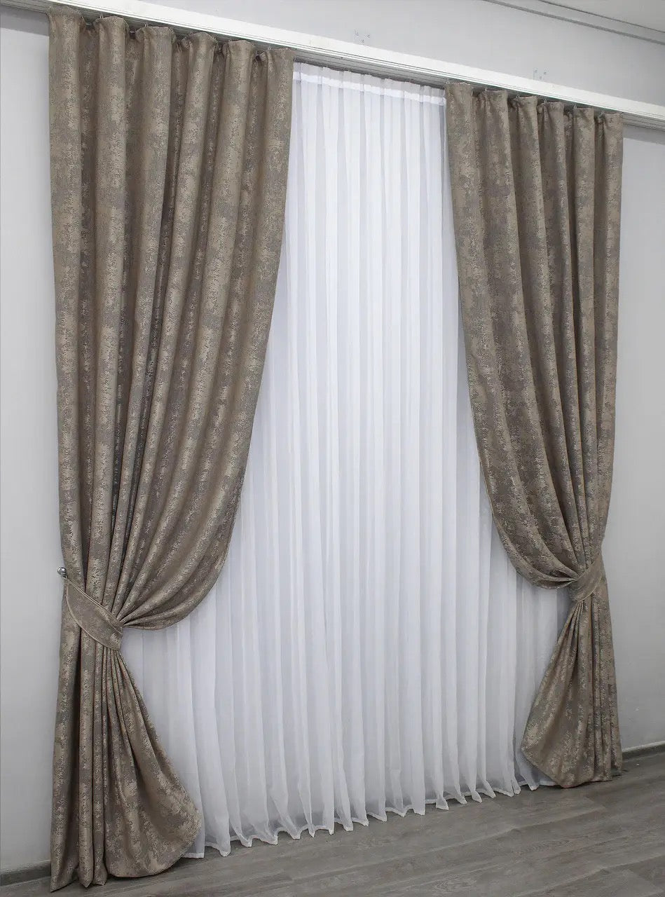 Stylish beige-grey curtains designed with a sophisticated tone, ideal for living rooms and bedrooms.
