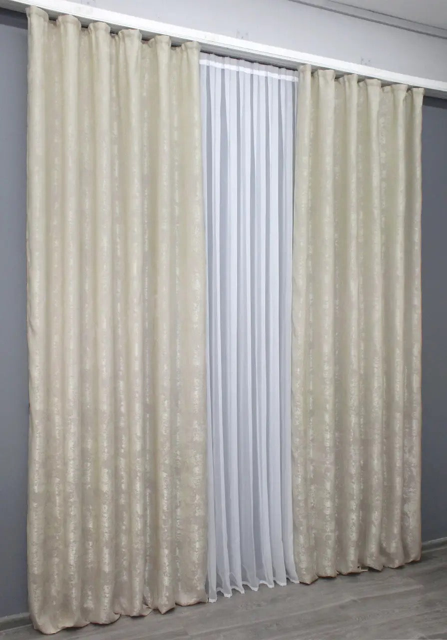 Soft-textured neutral beige jacquard curtains, featured in an exclusive Spring Collection, offering 70% light-blocking and a timeless, elegant design for sophisticated interiors.