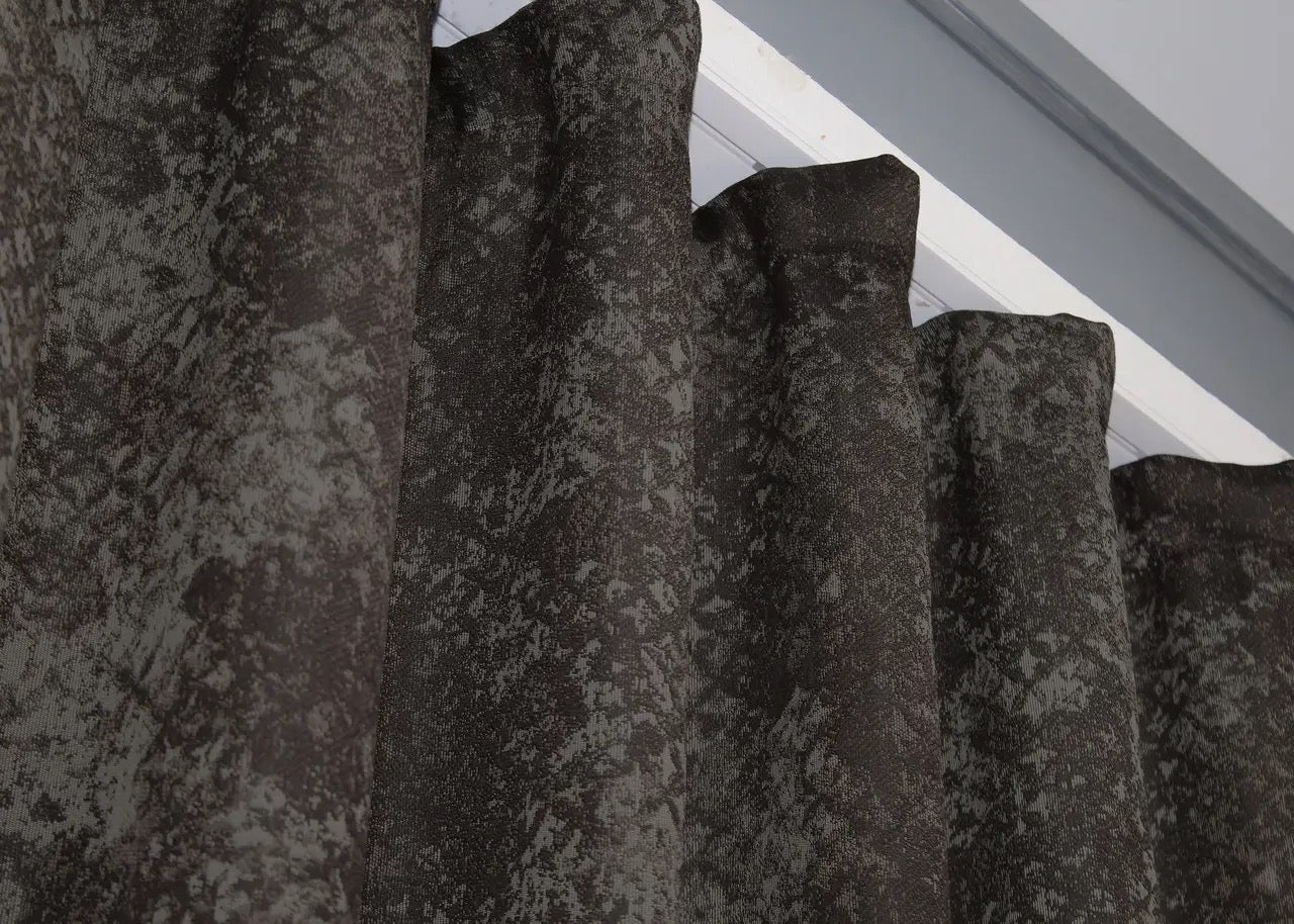 Sophisticated linen drapes in wenge brown and grey, offering a perfect balance of privacy and illumination.
