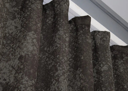 Sophisticated linen drapes in wenge brown and grey, offering a perfect balance of privacy and illumination.
