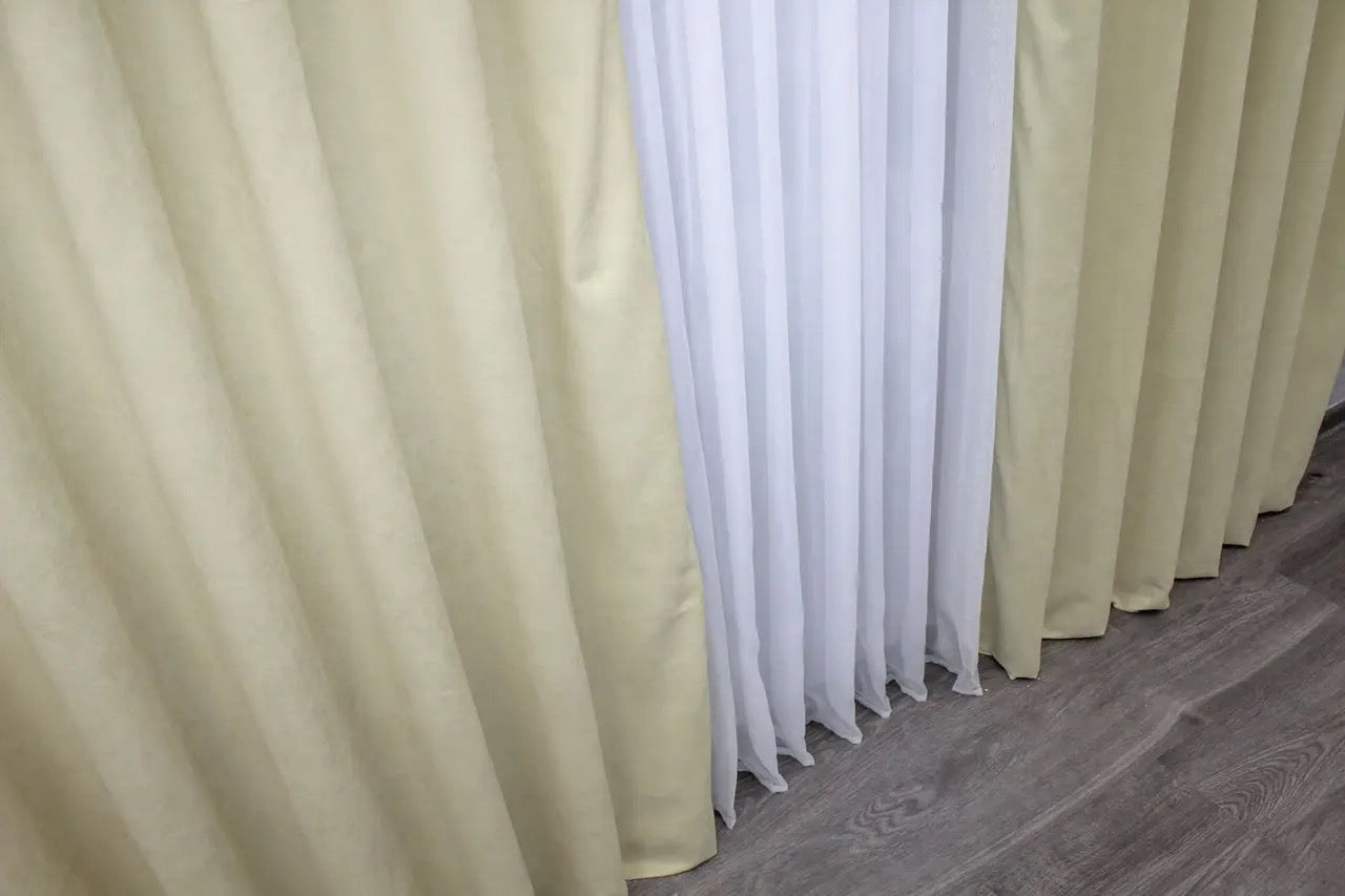 Soft cream microvelvet curtains with effortless installation, ideal for bedroom and living room styling.
