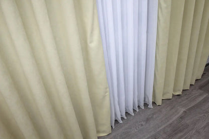 Soft cream microvelvet curtains with effortless installation, ideal for bedroom and living room styling.
