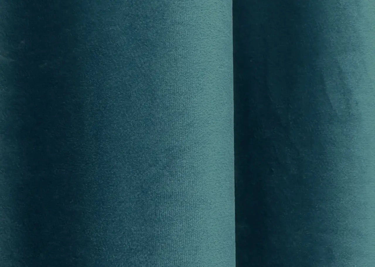 Ocean blue velvet blackout drapes, ideal for luxurious and stylish window treatments.
