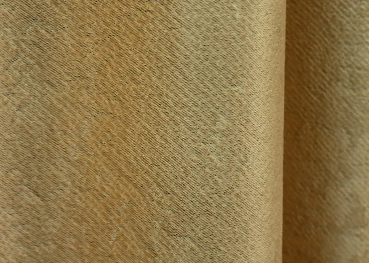 Ochre yellow textured linen curtains, perfect for creating a luxurious and cosy home ambiance.
