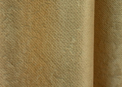 Ochre yellow textured linen curtains, perfect for creating a luxurious and cosy home ambiance.
