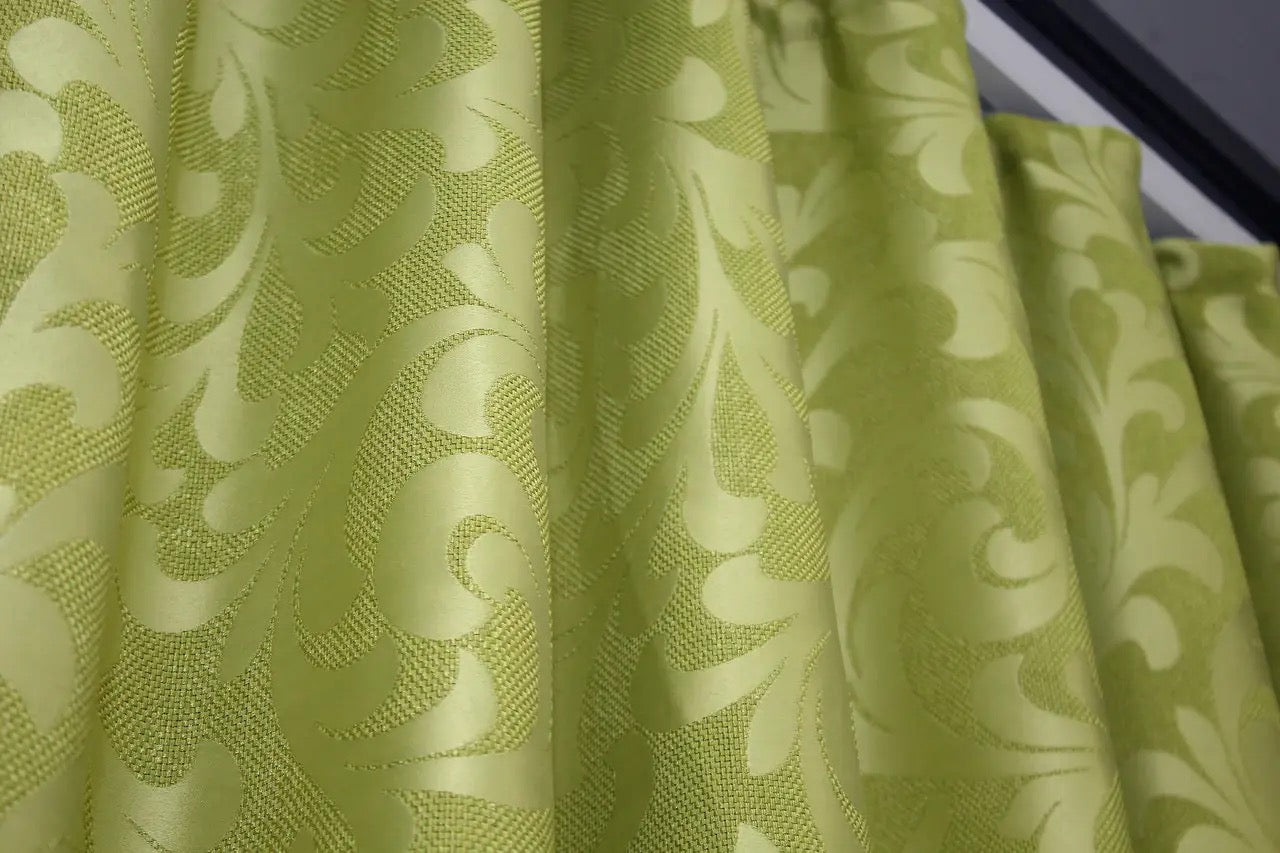 Ornamental-patterned olive green Venzel drapes, designed to create a stylish and inviting atmosphere.
