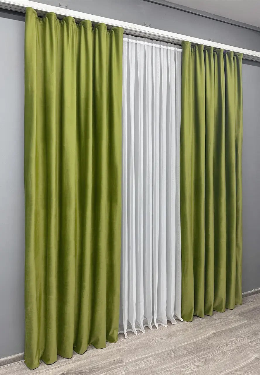 Elegant velvet curtains with matching tie-backs for a polished finish.
