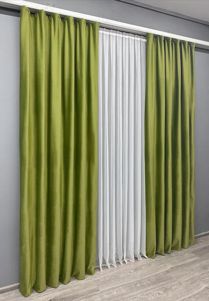 Elegant velvet curtains with matching tie-backs for a polished finish.
