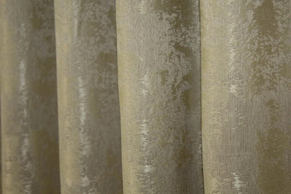 Shimmering gold curtains with a timeless design, seamlessly blending into luxurious and contemporary décor styles.
