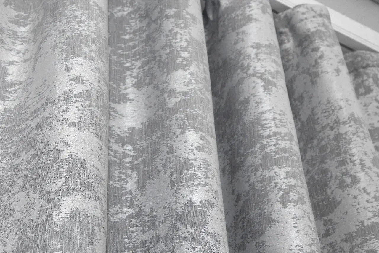 High-quality pale silver jacquard curtains with a smooth finish, creating a luxurious ambiance.
