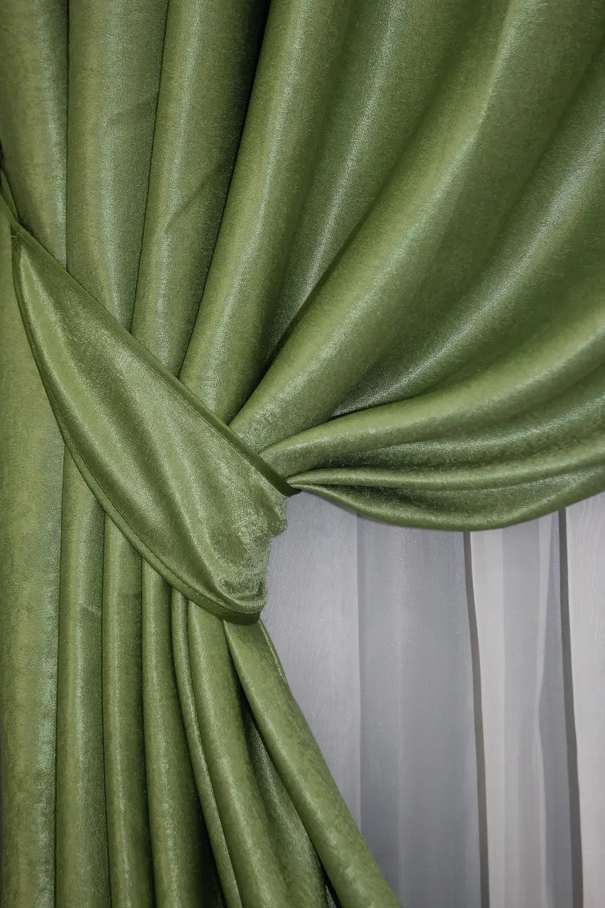 Pastel olive linen drapes, providing a soft and luxurious feel, with an elegant balance of privacy and natural light diffusion.
