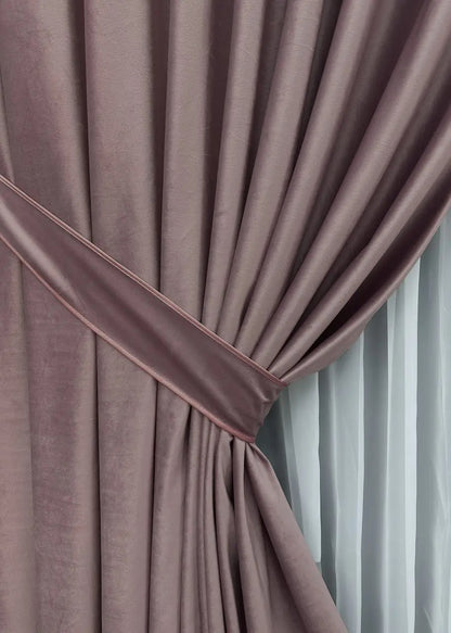 Pastel rose velvet curtains with a timeless design, crafted for bedroom and living room décor, adding sophistication and warmth.
