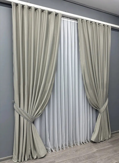 Sophisticated silver satin velvet curtains with plush, noise-reducing fabric, perfect for enhancing modern and classic home décor.
