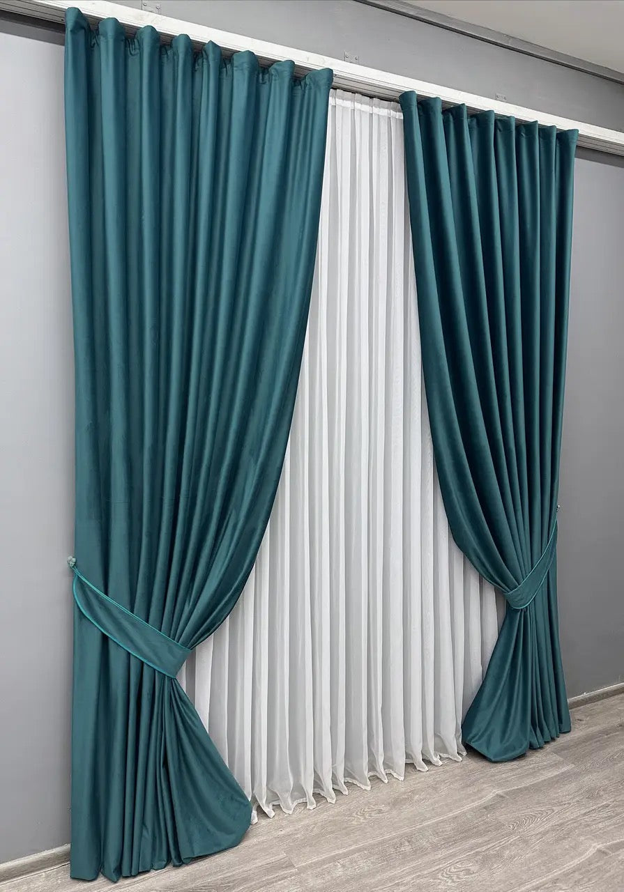 Petrol blue velvet blackout curtains, adding a touch of elegance and style to any living space.
