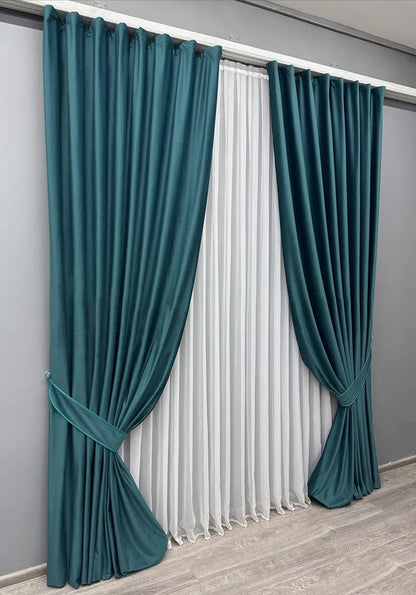 Petrol blue velvet blackout curtains, adding a touch of elegance and style to any living space.
