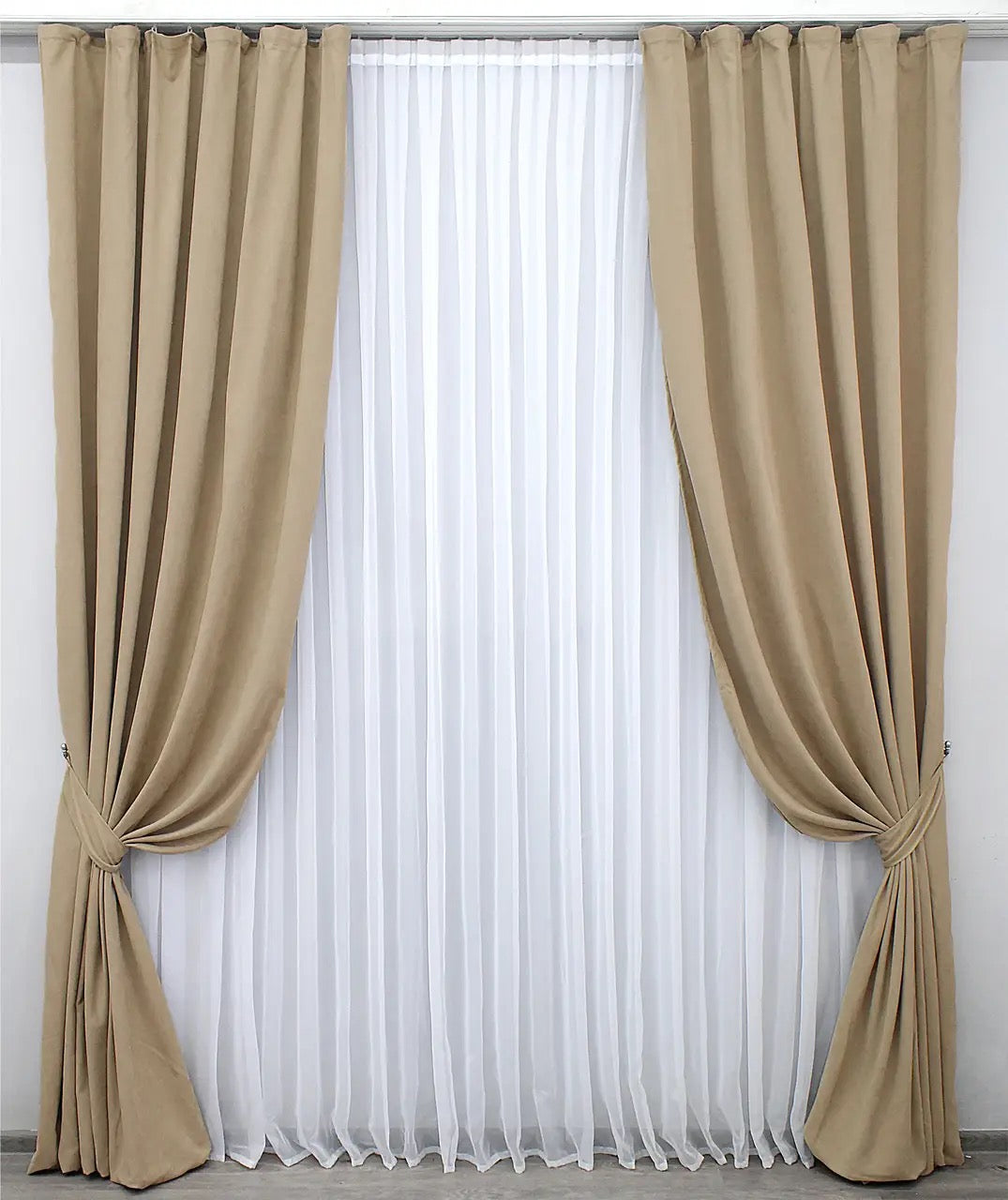 Sumptuously soft beige velvet curtains, offering warmth, elegance, and light-filtering properties.
