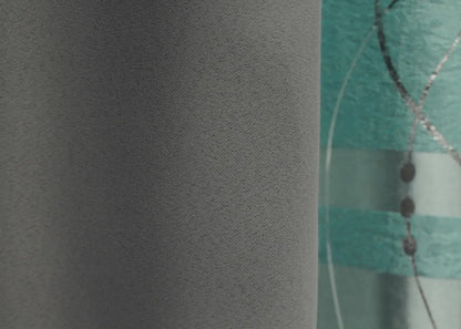 Premium blackout graphite & turquoise-grey curtains with a combined design for a luxurious and sophisticated feel.
