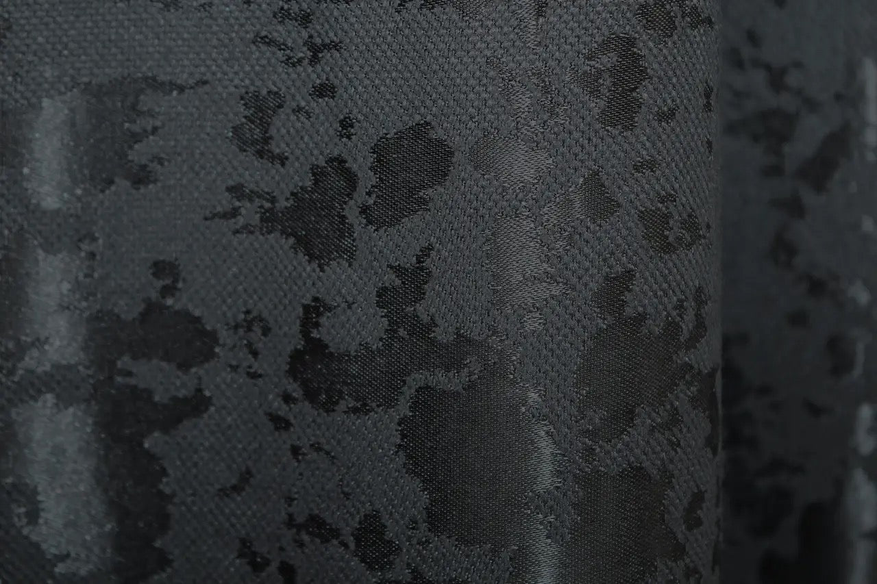 Stylish and breathable blue-graphite linen drapes with a subtle texture, perfect for elegant bedroom interiors.
