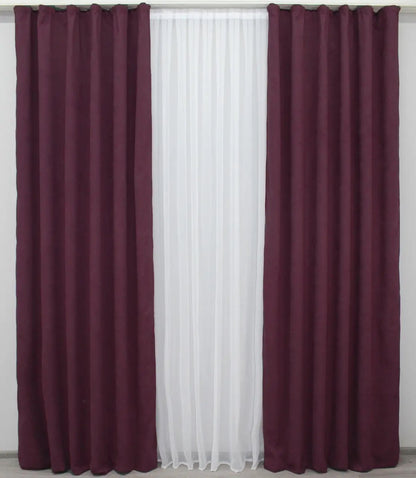 Plush burgundy velvet drapes with a sophisticated sheen, offering warmth and elegance.
