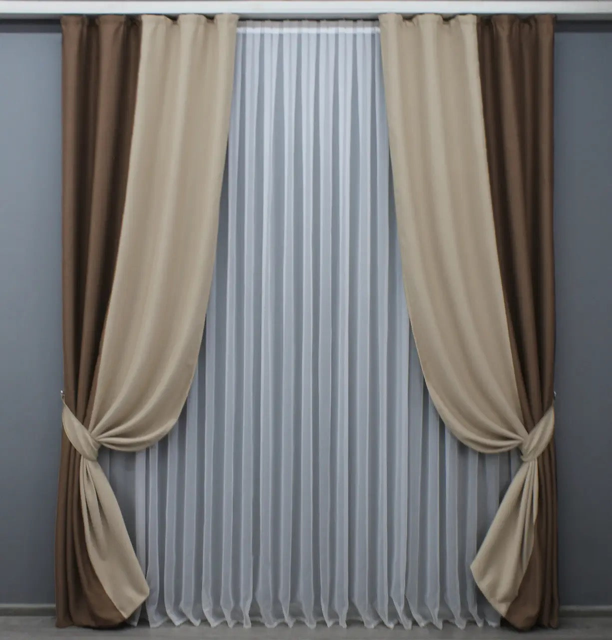 Premium chocolate and beige blackout curtains offering superior light-blocking properties and a luxurious, smooth drape.
