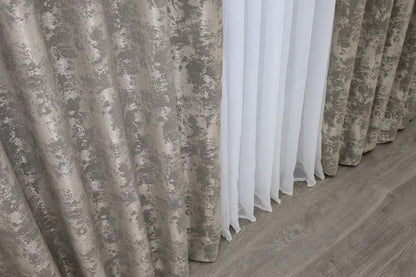 Luxurious coffee-grey curtains with an intricate woven jacquard pattern, adding depth and style to window décor.
