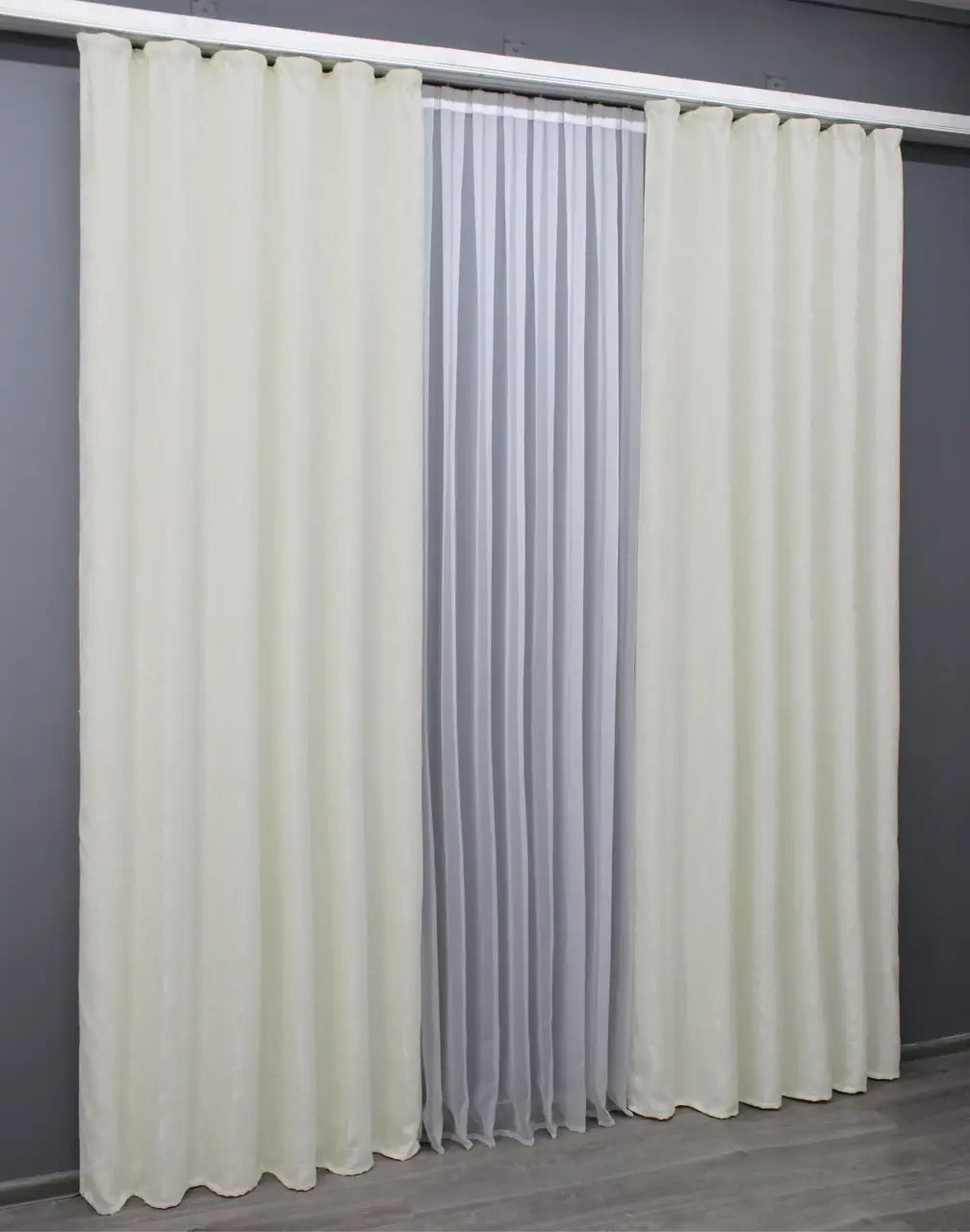 Luxury linen curtains in cream, offering a refined touch with a delicate marble texture.
