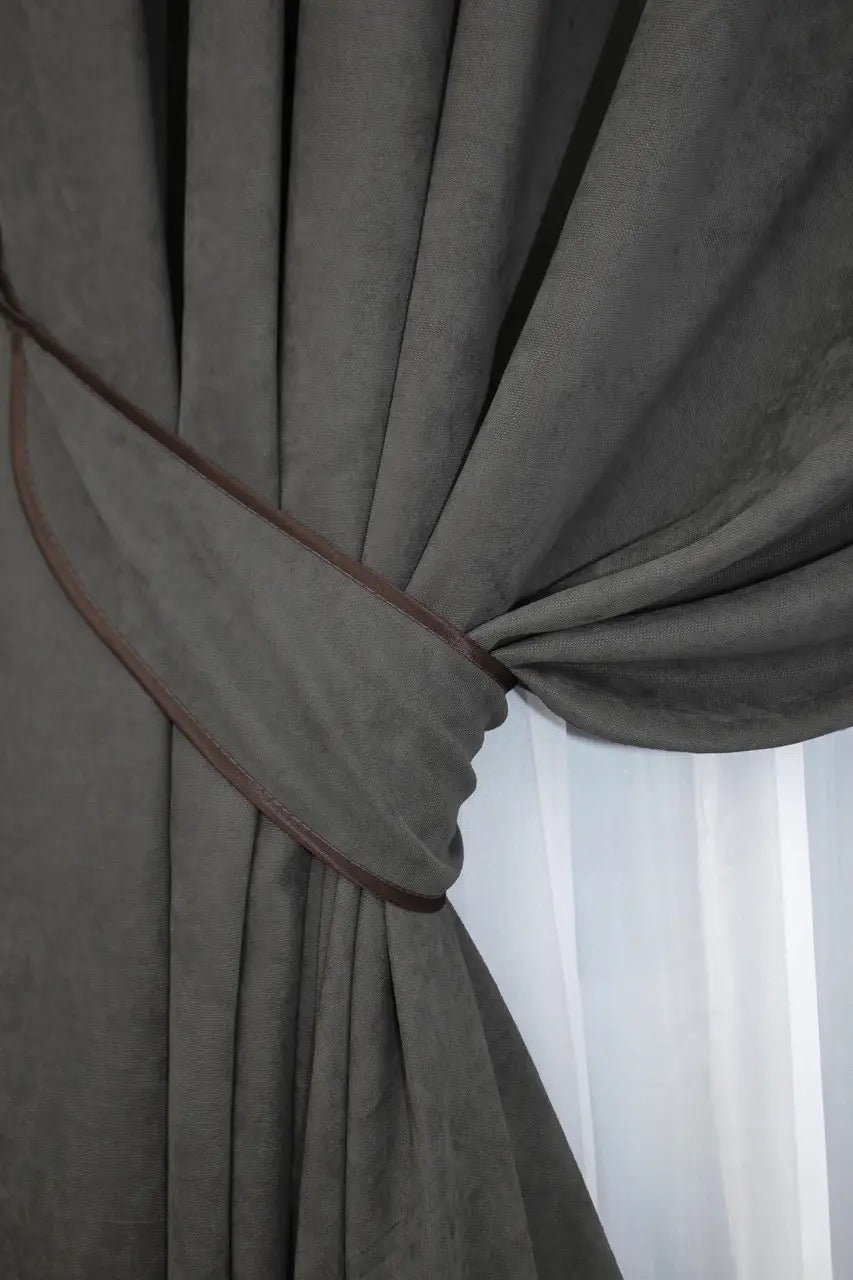 Refined dark grey curtains with a luxurious drape, perfect for upgrading home interiors.
