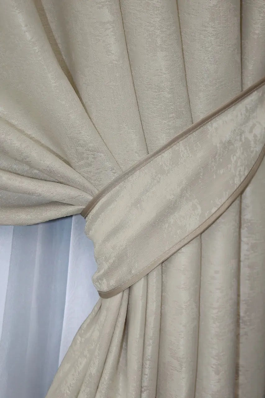 Stylish light beige curtains draped in a classic bedroom décor.
