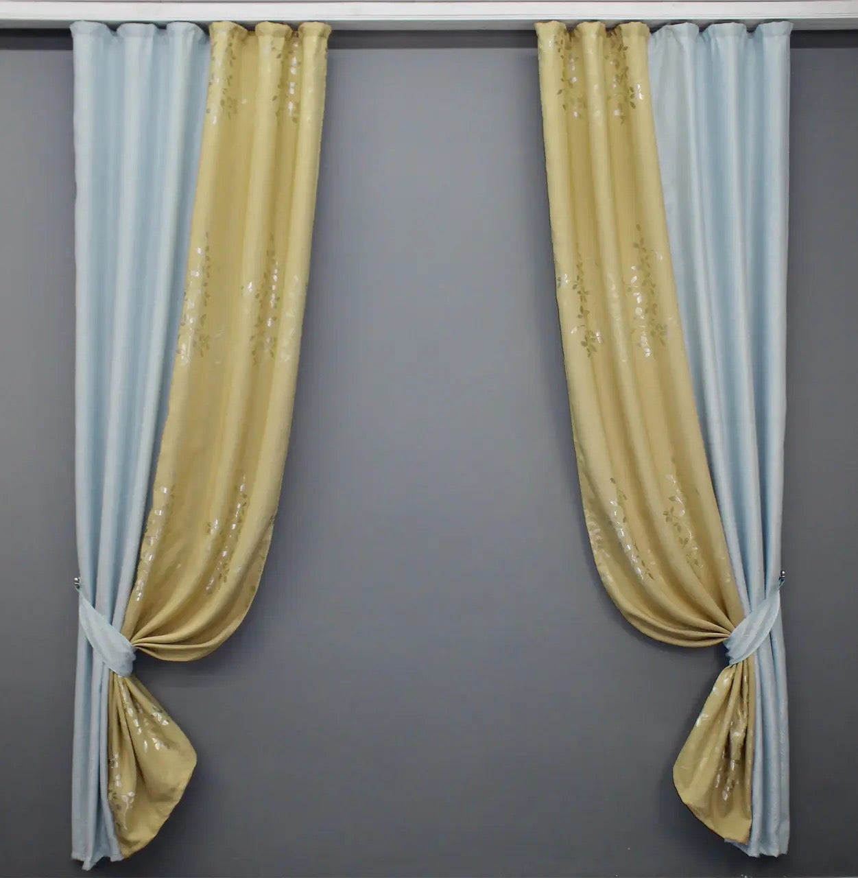 Premium light blue and beige linen curtains offering a beautifully textured drape, perfect for brightening up living rooms and bedrooms.
