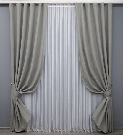 Premium blackout linen curtains in light grey, ensuring total darkness, privacy, and an elegant minimalist design.
