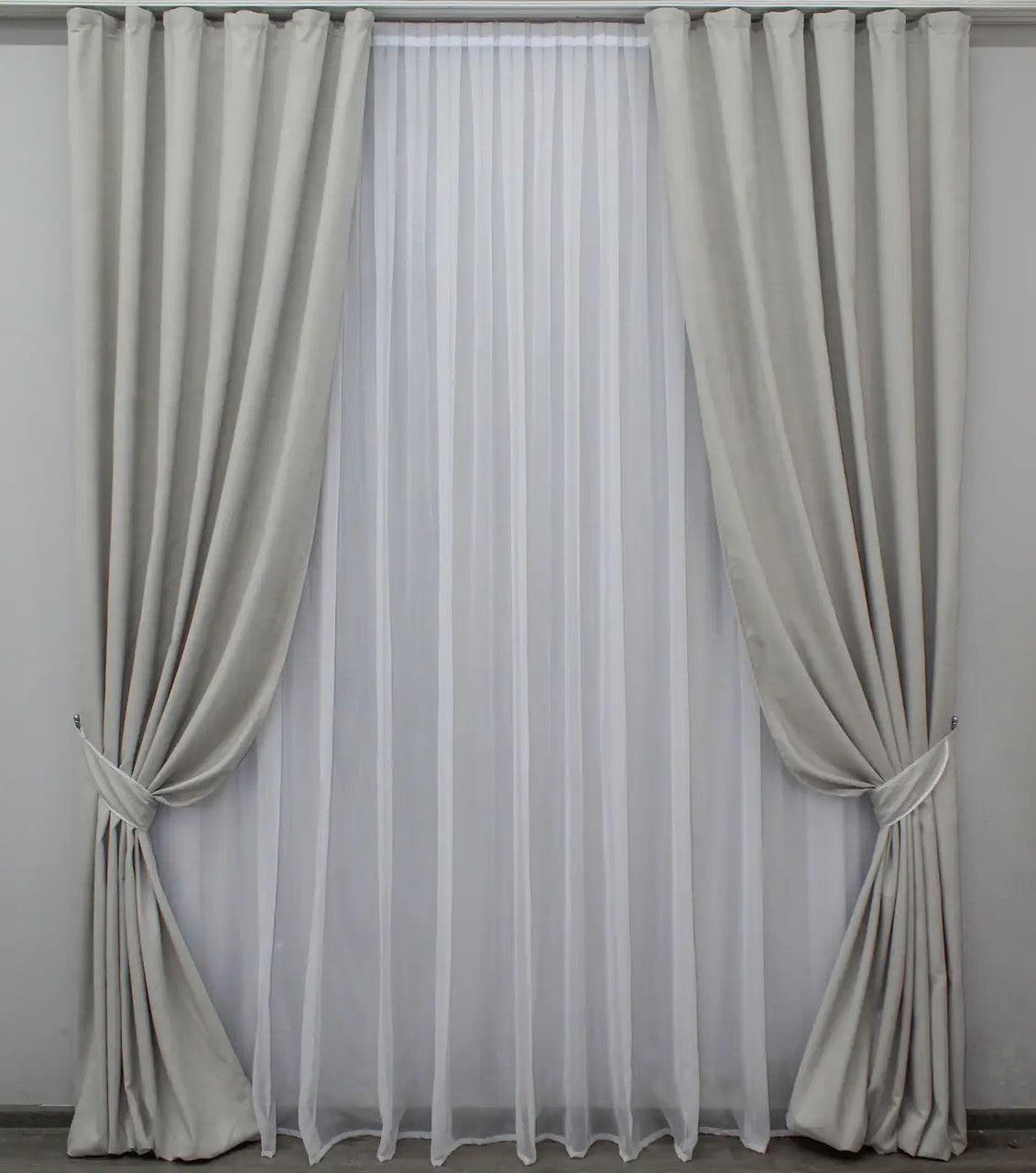 Premium-quality soft grey velvet curtains with a smooth texture for stylish bedrooms and living rooms.
