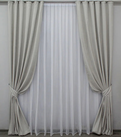 Premium-quality soft grey velvet curtains with a smooth texture for stylish bedrooms and living rooms.
