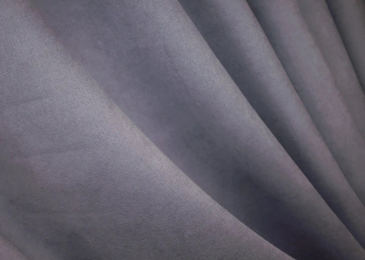 Elegant muted purple microvelvet curtains with refined texture and smooth finish.
