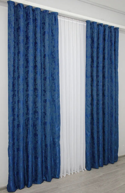 Vibrant Ocean Blue curtains with an intricate woven jacquard pattern, adding depth and style to window décor.
