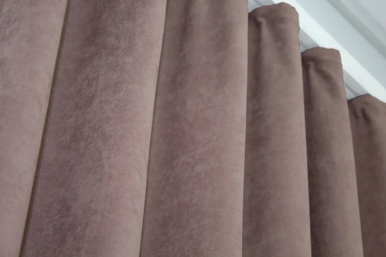 Elegant blush microvelvet curtains with refined texture and smooth finish.
