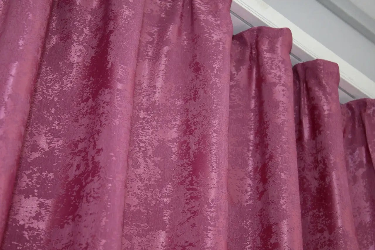 Luxurious raspberry curtains with an intricate woven jacquard pattern, adding depth and style to window décor.
