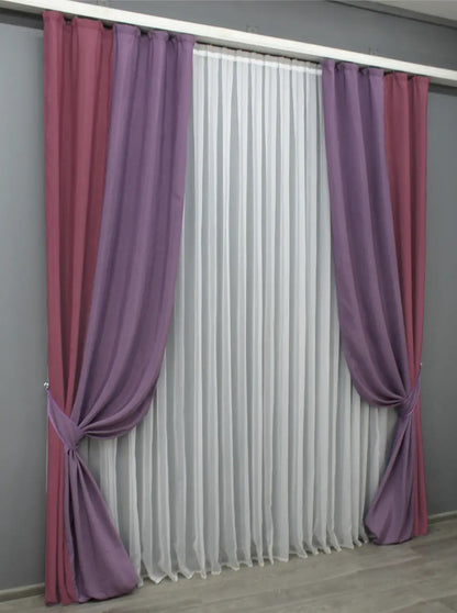 Bold two-tone raspberry and violet curtains with a luxurious texture, ideal for creating a statement in modern and eclectic interiors.
