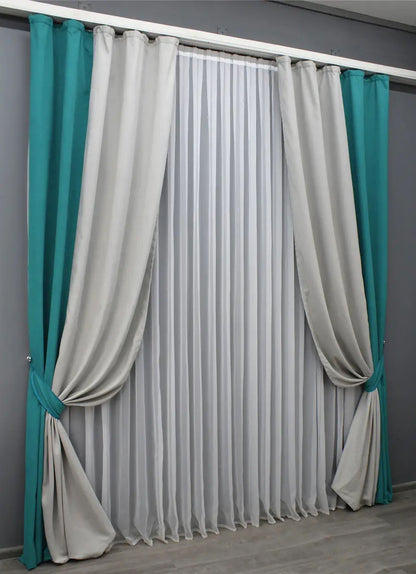 Stylish two-tone turquoise and light grey combined microvelvet curtains designed to bring a refined touch and luxury to living rooms and bedrooms.
