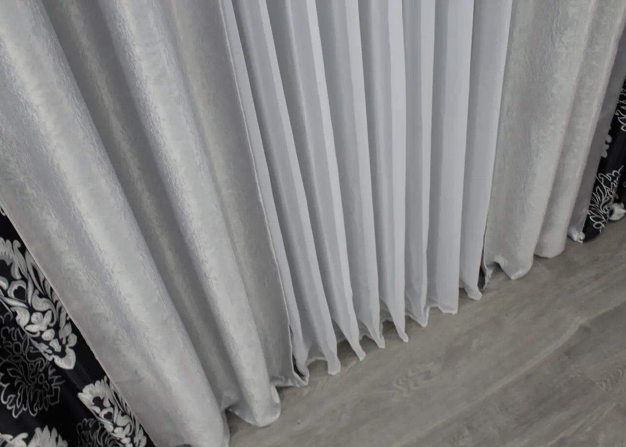 Refined two-tone black and light grey blackout curtains for a polished, sophisticated look in any room.
