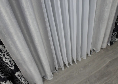 Refined two-tone black and light grey blackout curtains for a polished, sophisticated look in any room.
