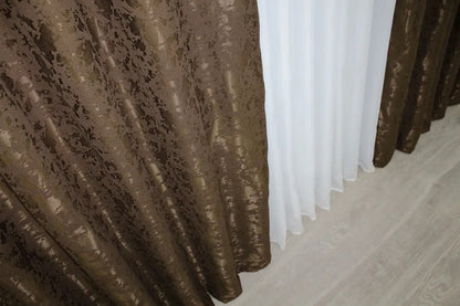 Premium brown linen drapes with a textured marble design, ideal for classic and contemporary interiors.
