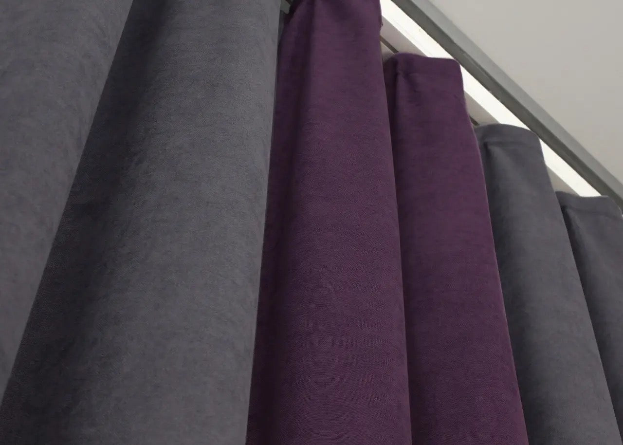 Refined graphite and deep plum microvelvet curtains, seamlessly blending rich color with a soft, plush texture for a sophisticated look.
