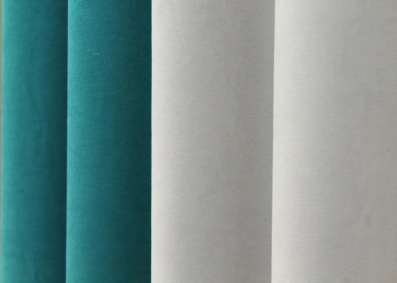 Turquoise and light grey combined microvelvet curtains, perfect for adding color contrast and a luxurious feel to modern home interiors.
