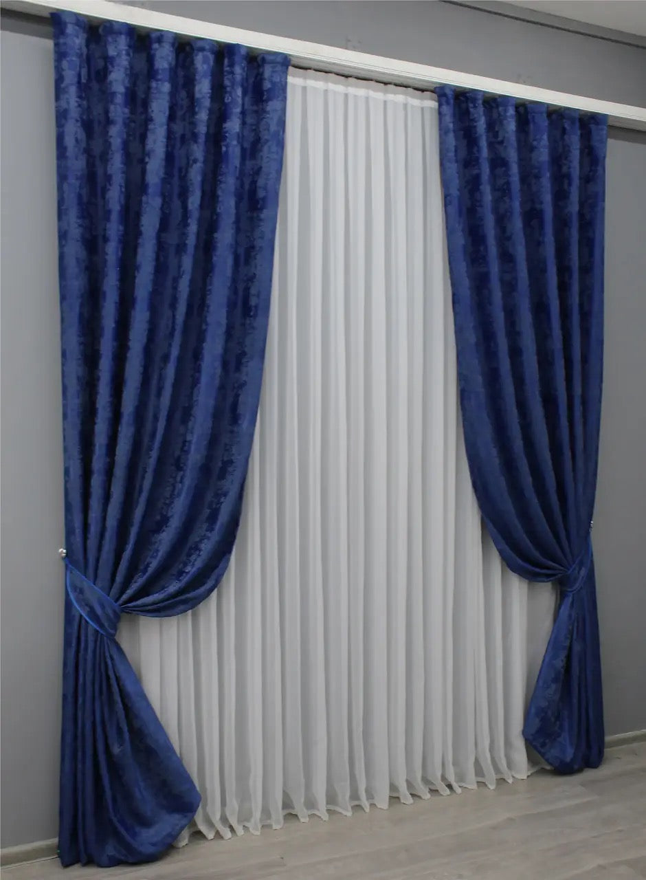 Stylish blue curtains with a refined, sophisticated tone, complementing contemporary and traditional interiors.
